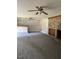 Spacious living room featuring a stone fireplace and wet bar with ample room for entertaining at 129 Jeffress Dr, Louisburg, NC 27549