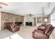 Living room features a stone fireplace and comfortable seating at 129 Jeffress Dr, Louisburg, NC 27549