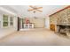 Unfurnished living room showcasing fireplace, bar area and natural light at 129 Jeffress Dr, Louisburg, NC 27549