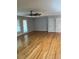 Spacious living room featuring hardwood floors and multiple windows for lots of light at 129 Jeffress Dr, Louisburg, NC 27549