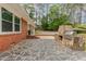 Outdoor kitchen and patio featuring a stone oven and mosaic stone design at 129 Jeffress Dr, Louisburg, NC 27549