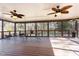 Spacious screened porch with ceiling fans and wooded views at 129 Jeffress Dr, Louisburg, NC 27549