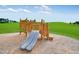 Wooden playground structure with double slide at 1309 Hazelnut Ridge Ln, Knightdale, NC 27545