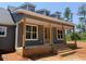 Gray home with covered porch, brick foundation, and steps at 2850 Sheep Pasture Rd, Spring Hope, NC 27882