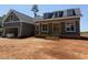 Charming home with gray siding, a covered porch, and well-manicured landscaping at 2850 Sheep Pasture Rd, Spring Hope, NC 27882