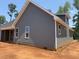 Gray two-story home with covered porch, featuring gray siding at 2850 Sheep Pasture Rd, Spring Hope, NC 27882