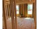Interior framing of a house under construction with light filtering through the windows, structural integrity showcased at 2850 Sheep Pasture Rd, Spring Hope, NC 27882