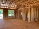 Framed interior view of a home under construction with windows, showcasing the structure and layout at 2850 Sheep Pasture Rd, Spring Hope, NC 27882