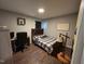 Bedroom with wood-look floors and a wooden bed frame at 3508 Guess Rd, Durham, NC 27705