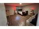 Bedroom with wood-look floors and a dark-colored bed frame at 3508 Guess Rd, Durham, NC 27705