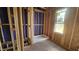 Unfinished bathroom featuring wood frame, window, and a shower stall at 3934 Well Fleet Drive, Fuquay Varina, NC 27526