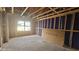 A framed, unfinished room with a window letting in natural light at 3934 Well Fleet Drive, Fuquay Varina, NC 27526