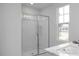 Bathroom featuring a glass-enclosed shower and ample natural light at 3934 Well Fleet Drive, Fuquay Varina, NC 27526