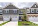 Charming townhome with two-car garage and green lawn at 3934 Well Fleet Drive, Fuquay Varina, NC 27526