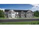 New townhome with two-car garage and green lawn at 3934 Well Fleet Drive, Fuquay Varina, NC 27526