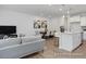 Modern kitchen with white cabinets, white quartz countertops, and an island at 3934 Well Fleet Drive, Fuquay Varina, NC 27526
