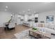 Open-concept living room boasts an island kitchen, dining area and comfortable seating at 3934 Well Fleet Drive, Fuquay Varina, NC 27526