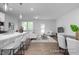 Open concept living space with kitchen island, living area, and dining space at 3934 Well Fleet Drive, Fuquay Varina, NC 27526