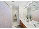 Double vanity bathroom with a linen closet and tiled floors at 418 Bergen Ave, Apex, NC 27502