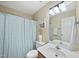 Clean bathroom featuring a shower/tub combo and a vanity with storage at 418 Bergen Ave, Apex, NC 27502