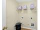 Laundry room with storage shelf and 'Wash & Dry' laundry basket at 418 Bergen Ave, Apex, NC 27502