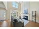 Bright living room with fireplace and large windows at 418 Bergen Ave, Apex, NC 27502