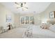 Spacious main bedroom with carpet, ceiling fan, and light, neutral walls at 418 Bergen Ave, Apex, NC 27502