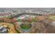 Community aerial view featuring beautiful landscaping, a pool, tennis courts, and tree-lined streets at 4236 Aviemore, Burlington, NC 27215