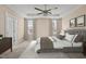 Spacious bedroom with a ceiling fan, neutral tones, and large windows for natural light at 4236 Aviemore, Burlington, NC 27215