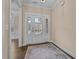 Welcoming foyer with a glass-paneled front door, hardwood floors, and an elegant area rug at 4236 Aviemore, Burlington, NC 27215