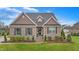 Charming brick home with well-manicured landscaping and a classic architectural design in a suburban neighborhood at 4236 Aviemore, Burlington, NC 27215