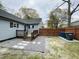 Backyard featuring deck, gray siding, wooden fence and trash bins at 1003 W Anderson St, Selma, NC 27576