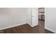 Bedroom with wood-look flooring, closet and doorway leading to kitchen at 1003 W Anderson St, Selma, NC 27576
