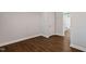 Bedroom with wood-look floors and a doorway leading to bathroom at 1003 W Anderson St, Selma, NC 27576