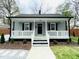 Inviting home with a covered front porch, offering curb appeal and a welcoming entrance at 1003 W Anderson St, Selma, NC 27576