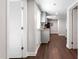 Galley kitchen view with stainless steel appliances, gray cabinets, and granite countertops at 1003 W Anderson St, Selma, NC 27576
