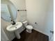 Stylish half bathroom with a modern sink, mirror, and sleek fixtures at 10548 Brookside Reserve Rd, Raleigh, NC 27614