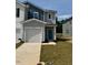 Charming two-story home featuring a one car garage and beautifully landscaped front yard at 10548 Brookside Reserve Rd, Raleigh, NC 27614