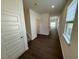 Inviting home entryway featuring dark wood flooring and a staircase leading to the upper level at 10548 Brookside Reserve Rd, Raleigh, NC 27614