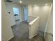 Upstairs landing featuring carpet, and a modern staircase leading to the lower level at 10548 Brookside Reserve Rd, Raleigh, NC 27614