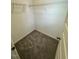 Walk-in closet with wire shelving, neutral walls, and gray carpeting at 10548 Brookside Reserve Rd, Raleigh, NC 27614