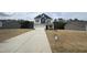 Traditional style home showcasing blue and grey siding and a two-car garage on a sprawling lot at 165 Knoll Way, Sanford, NC 27332