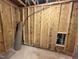 Unfinished basement with exposed framing and utilities, ready for customization at 200 Ironwood Lot 39 Blvd, Youngsville, NC 27596