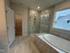 Luxurious bathroom featuring a large shower with glass door and a soaking tub at 200 Ironwood Lot 39 Blvd, Youngsville, NC 27596