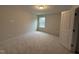 Bedroom with neutral carpet, light walls and base trim and a single window at 200 Ironwood Lot 39 Blvd, Youngsville, NC 27596