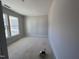 Unfinished room ready to be transformed into a living space, with natural light from a large window at 200 Ironwood Lot 39 Blvd, Youngsville, NC 27596