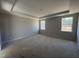 Spacious bedroom with tray ceiling, two windows providing natural light and scenic views at 200 Ironwood Lot 39 Blvd, Youngsville, NC 27596