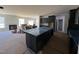New home featuring a modern kitchen island overlooking the unfinished living room at 200 Ironwood Lot 39 Blvd, Youngsville, NC 27596