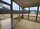 View from inside the screened-in back porch overlooking the backyard and wooded area at 200 Ironwood Lot 39 Blvd, Youngsville, NC 27596