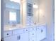 Elegant bathroom with double vanity, white cabinetry, and plenty of storage at 200 Ironwood Lot 39 Blvd, Youngsville, NC 27596